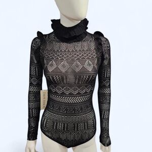 Ronny Kobo Women's Maeve Bodysuit in black lace with ruffle details
Size XS